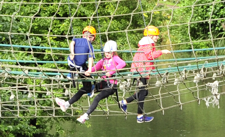 3 young people on cargo net